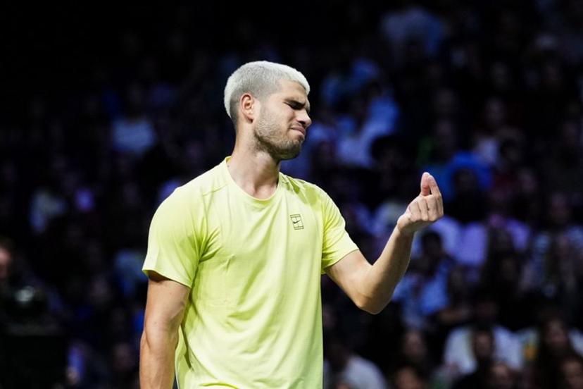 Spain's Carlos Alcaraz reacts as he plays against Britain's Cameron Norrie during their men's singles match on day two of the Paris ATP Masters 1000 tennis tournament at the Paris La Défense Arena in Nanterre, on the outskirts of Paris, on October 28, 2025.  Dimitar DILKOFF / AFP