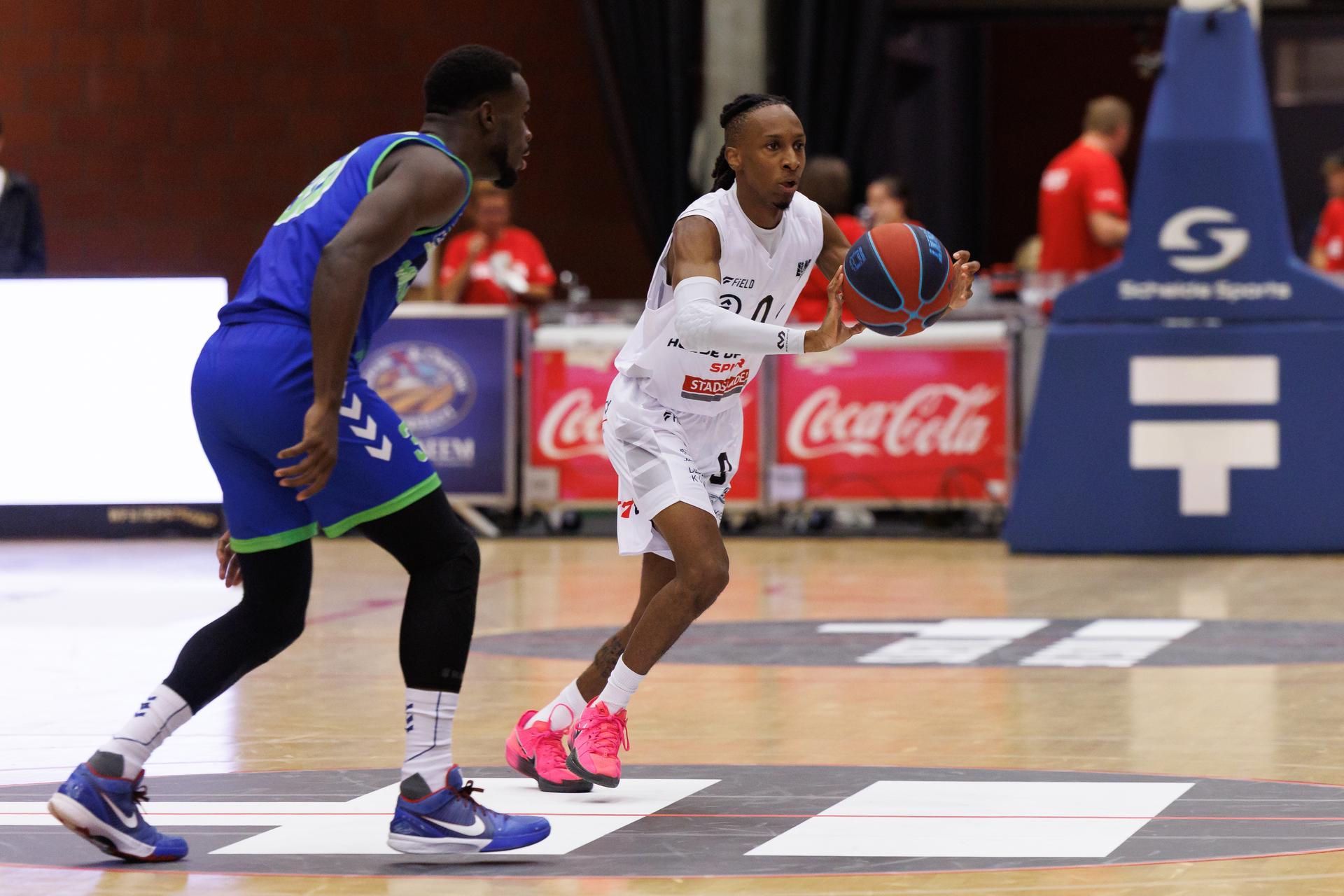 Mons' Tito Casero and Kortrijk's Darren Williams fight for the ball during a basketball match between House of Talents Spurs Kortrijk and Mons-Hainaut, Friday 10 October 2025 in Kortrijk, on day 3 of the 'BNXT League' first division basket championship. BELGA PHOTO KURT DESPLENTER