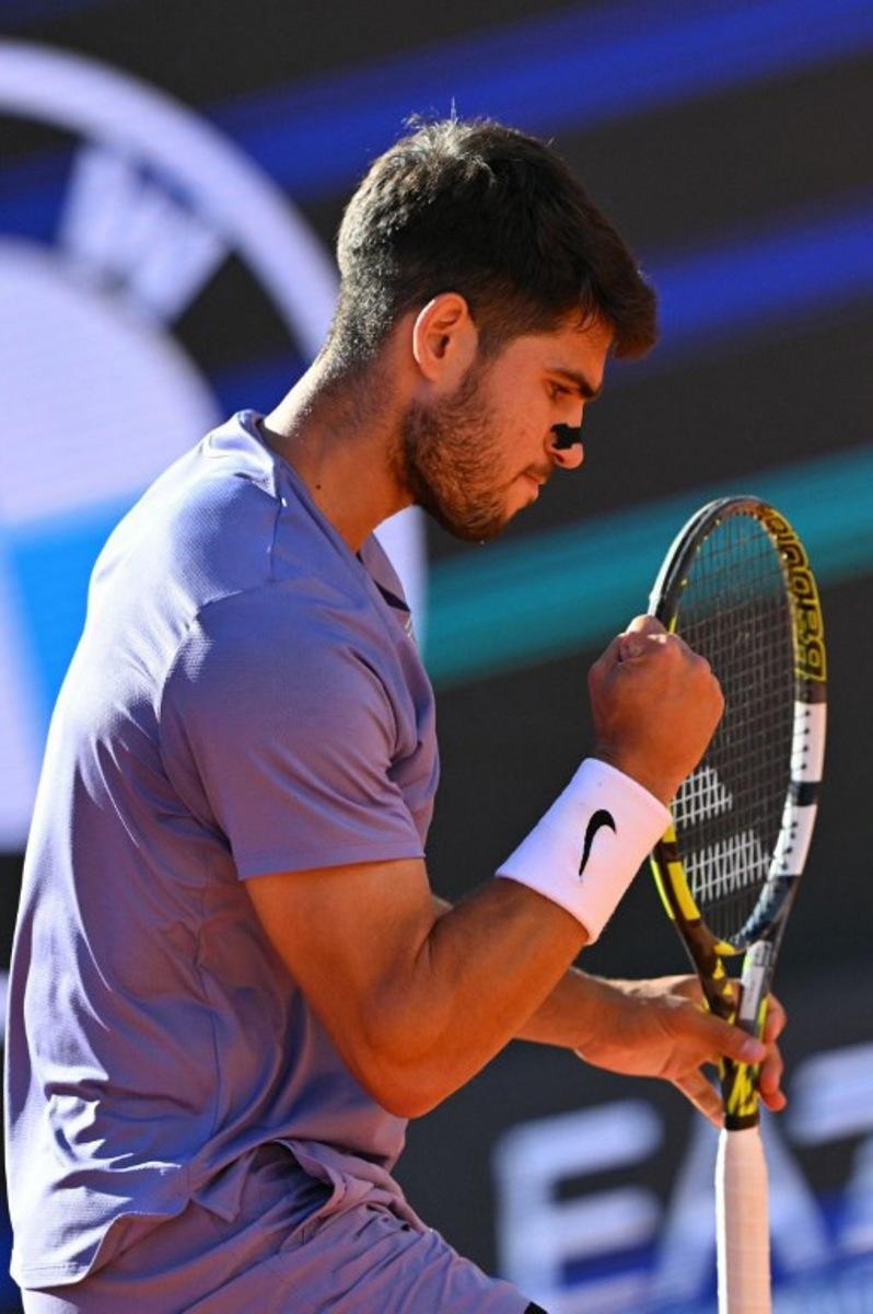 Spain's Carlos Alcaraz reacts during his men's singles semi-final match against Italy's Lorenzo Musetti for the ATP Rome Open tennis tournament at Foro Italico in Rome on May 16, 2025.   Andreas SOLARO / AFP