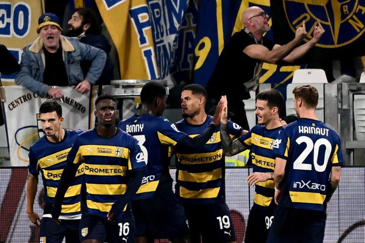 Parma's Swiss midfielder #19 Simon Sohm (C) celebrates scoring his team's second goal during the Italian Serie A football match between Juventus and Parma, at the Allianz Stadium, in Turin on October 30, 2024.   Marco BERTORELLO / AFP