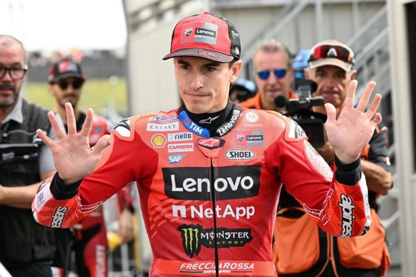Ducati Lenovo Team's Spanish MotoGP rider Marc Marquez greets fans at the paddock before the warm-up session of the MotoGP Japanese Grand Prix at the Mobility Resort Motegi in Motegi, Tochigi prefecture on September 28, 2025.  Toshifumi KITAMURA / AFP