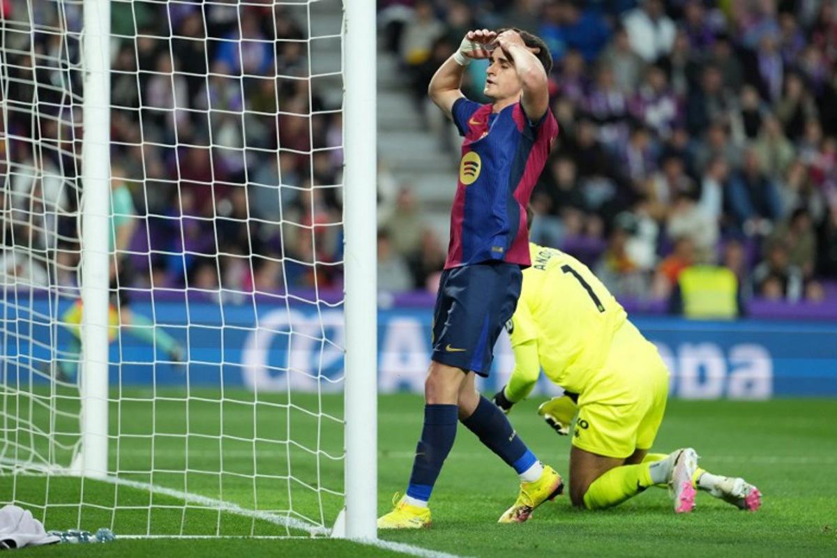 Barcelona's Spanish forward #18 Pau Victor Delgado reacts to missing a goal opportunity during the Spanish league football match between Real Valladolid FC and FC Barcelona at the Jose Zorrilla stadium in Valladolid on May 3, 2025.  Cesar Manso / AFP