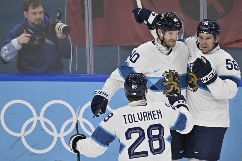 Finland's #40 Joel Armia, Finland's #56 Erik Haula and Finland's #28 Eeli Tolvanen celebrate after their team's second goal during the men's bronze medal ice hockey match between Slovakia and Finland at the Milano Santagiulia Ice Hockey Arena during the Milano Cortina 2026 Winter Olympic Games in Milan, on February 21, 2026.  Alexander NEMENOV / AFP