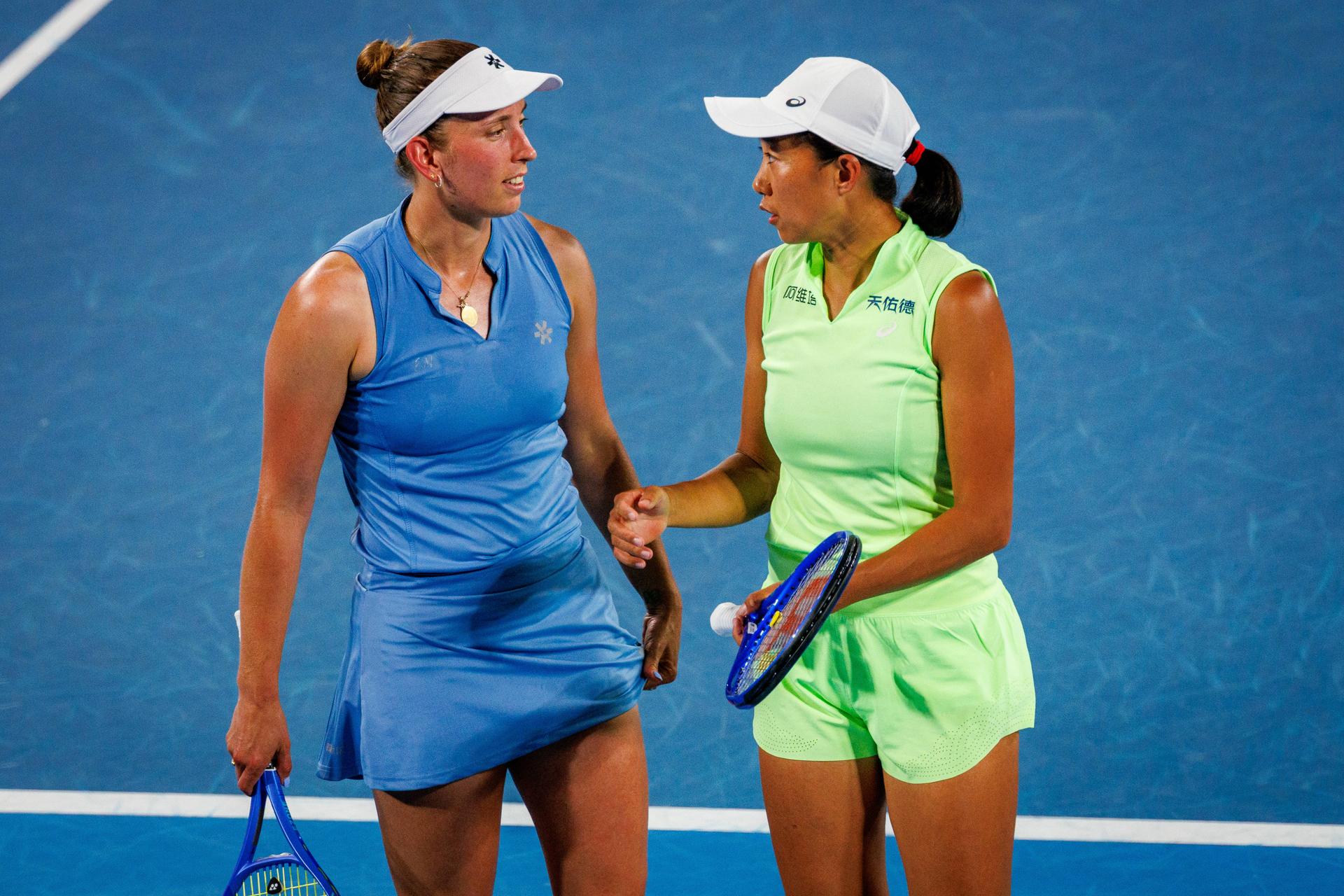 Belgium's Elise Mertens (blue) and Chinese Shuai Zhang (yellow) pictured in action during a tennis match between US pair Baptiste/Stearns and Belgian/ Chinese pair Mertens/Zhang, in the 1/8 final of the women doubles at the Australian Open, in Melbourne Park, Melbourne on Tuesday 27 January 2026.  BELGA PHOTO PATRICK HAMILTON  --- BENELUX ONLY   ---