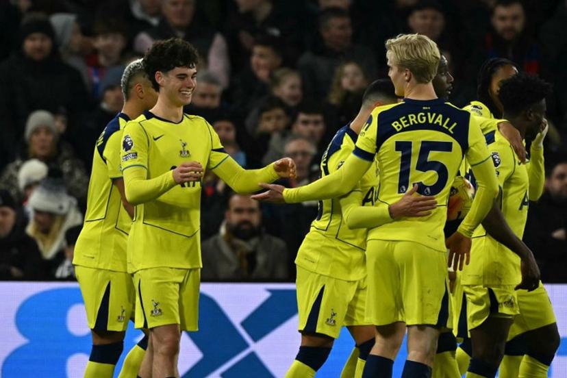 Tottenham Hotspur's English midfielder #14 Archie Gray (2L) celebrates with teammates after scoring the opening goal during the English Premier League football match between Crystal Palace and Tottenham Hotspur at Selhurst Park in south London on December 28, 2025.  Glyn KIRK / AFP