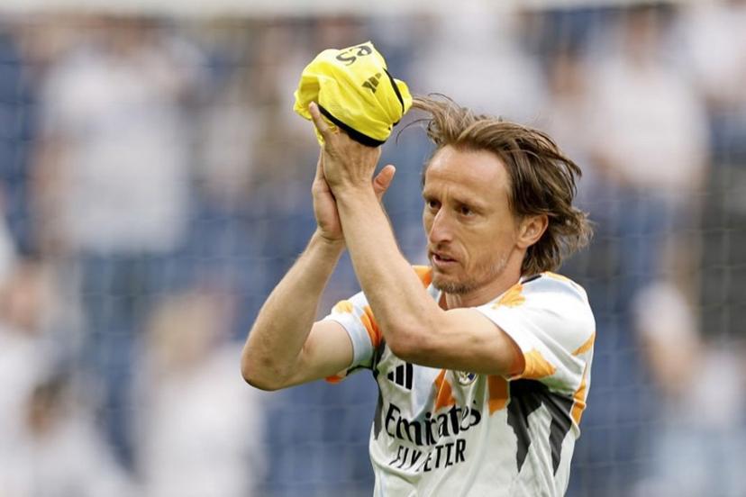 Real Madrid's Croatian midfielder #10 Luka Modric acknowledges supporters before the Spanish league football match between Real Madrid CF and Real Sociedad at Santiago Bernabeu Stadium in Madrid on May 24, 2025.  OSCAR DEL POZO / AFP