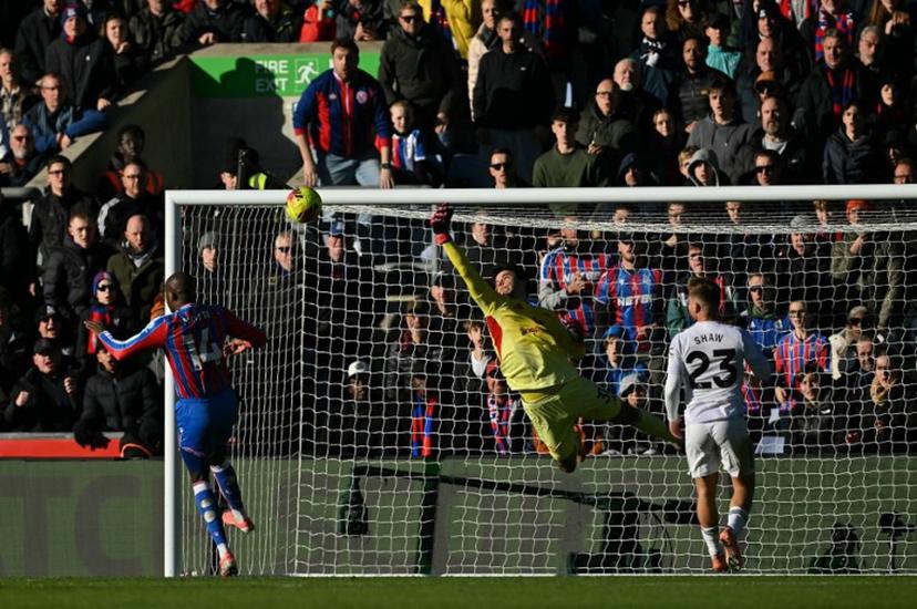 Manchester United's Belgian goalkeeper #31 Senne Lammens makes a save during the English Premier League football match between Crystal Palace and Manchester United at Selhurst Park in south London on November 30, 2025.  Glyn KIRK / AFP