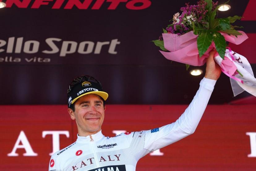 TTeam Visma-Lease a Bike's Belgian rider Cian Uijtdebroeks celebrates the best young rider's white jersey on the podium of the 9th stage of the 107th Giro d'Italia cycling race, 214km between Avezzano and Naples, on May 12, 2024.   Luca Bettini / AFP