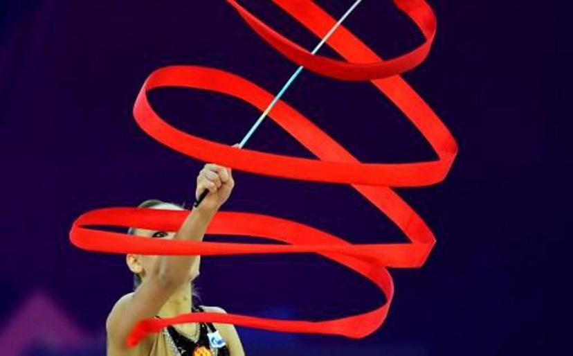 Gold medalist Russia's Dina Averina performs with her ribbon in Papp Laszlo Arena of Budapest on May 21, 2017 during the apparatus final day of 33rd European Rythmic Gymnastic Championships.    ATTILA KISBENEDEK / AFP