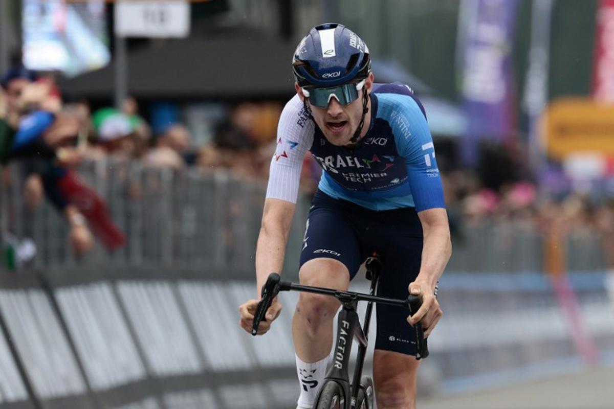Israel-Premier Tech's Canadian rider Derek Gee crosses the finish line  of the 17th stage of the 108th Giro d'Italia cycling race, 155kms from San Michele all'Adige to Bormio, on May 28, 2025.  Luca Bettini / AFP