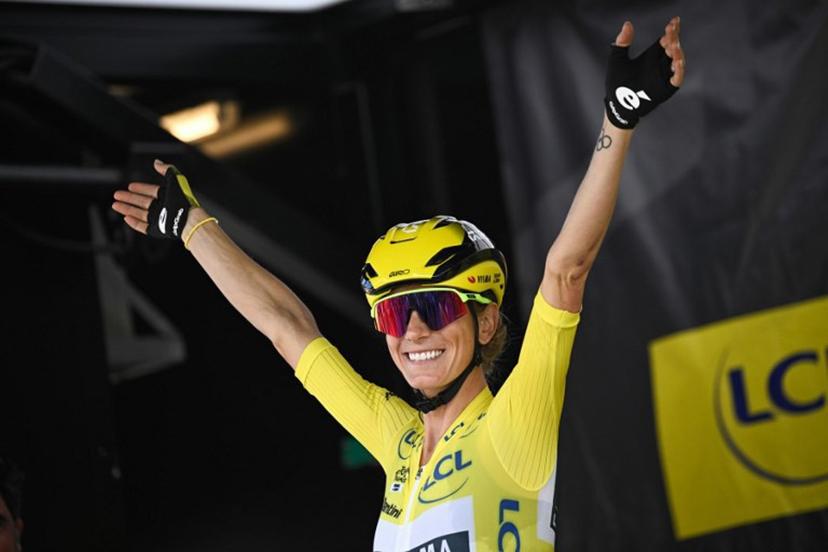 Overall leader's Yellow jersey Team Visma | Lease a Bike's French rider Pauline Ferrand-Prevot waves to supporters during the signature ceremony ahead of the start of the 9th and final stage (out of 9) of the fourth edition of the Women's Tour de France cycling race, 124.1 km from Praz-sur-Arly to Chatel, in Praz-sur-Arly eastern France, on August 3, 2025.  JULIEN DE ROSA / AFP