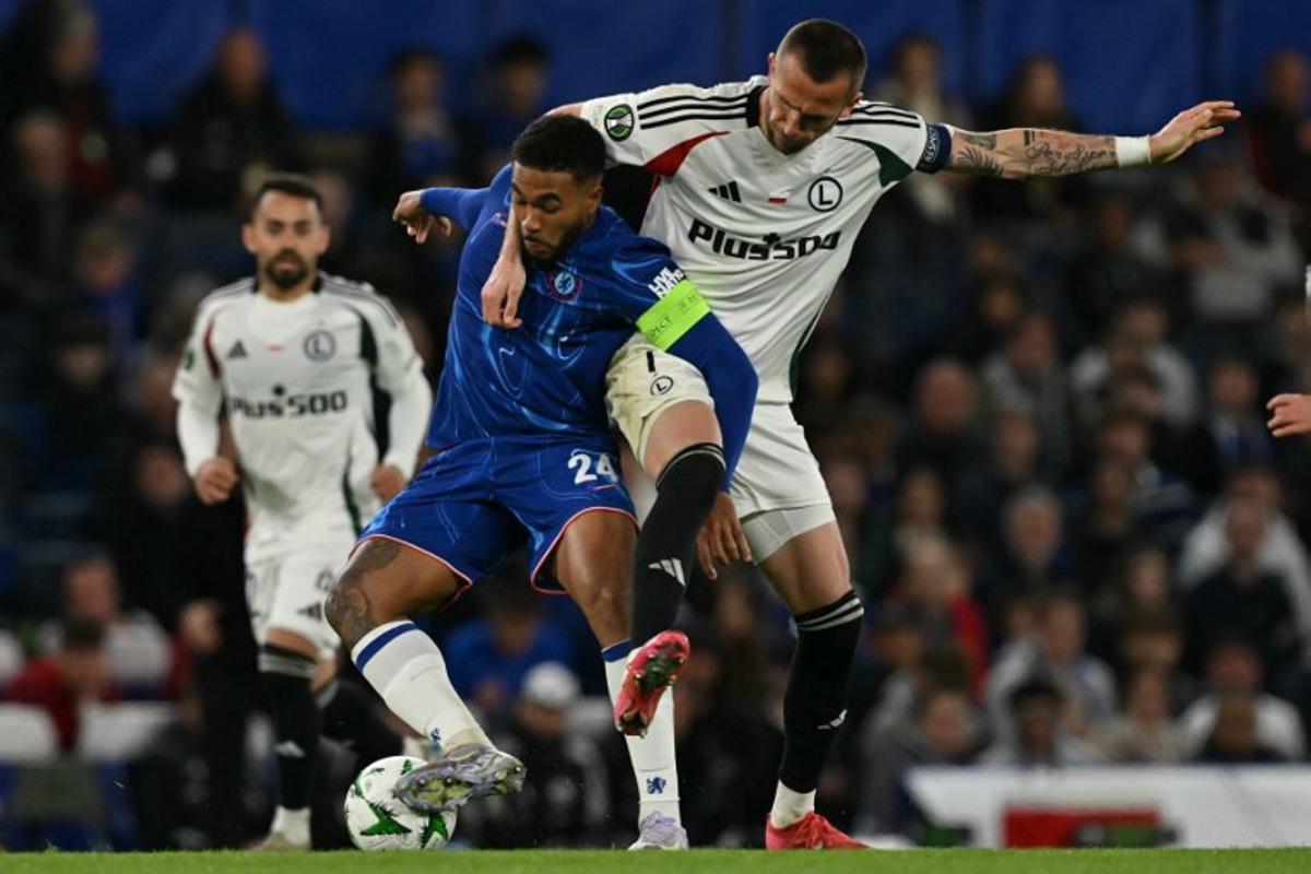 Chelsea's English defender #24 Reece James (L) vies with Legia Warszawa's Czech forward #07 Tomas Pekhart (R) during the UEFA Europa Conference League quarter-final, second leg football match between Chelsea and Legia Warsaw at Stamford Bridge in London on April 17, 2025.  Glyn KIRK / AFP