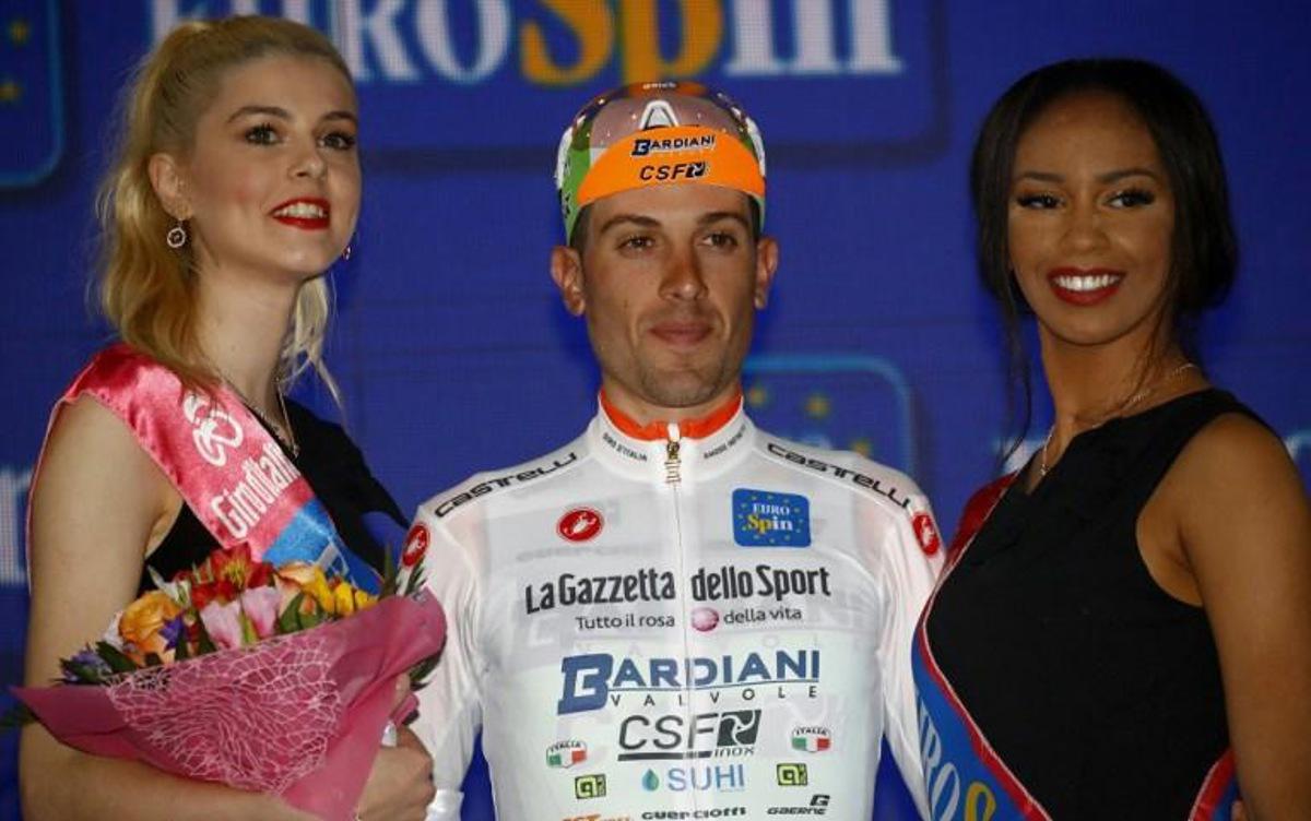 Team Bardiani rider Italy's Giovanni Carboni, White jersey of the leader of the young rider category celebrates on podium after finishing first in stage eight of the 102nd Giro d'Italia - Tour of Italy - cycle race, 239kms from Tortoreto Lido to Pesaro on May 18, 2019.  Luk BENIES / AFP