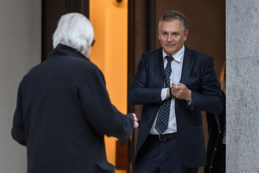Former FIFA number two Jerome Valcke (R) leaves on the opening day of an appeal before the Swiss Federal Criminal Court in Bellinzona, southern Switzerland, on March 7, 2022. The Federal Prosecutor's Office appealed an October 2020 judgement which acquitted Al-Khelaifi and handed former FIFA number two Jerome Valcke a suspended sentence on accusation of "corrupt agreement » on some 2026 and 2030 FIFA World Cups media rights. Fabrice COFFRINI / AFP