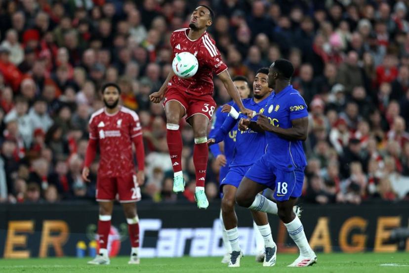 Liverpool's Dutch midfielder #38 Ryan Gravenberch controls the ball whilst under pressure from Chelsea's English striker #18 Danny Welbeck during the English League Cup fourth round football match between Liverpool and Chelsea at Anfield in Liverpool, north west England on October 28, 2026.  Darren Staples / AFP