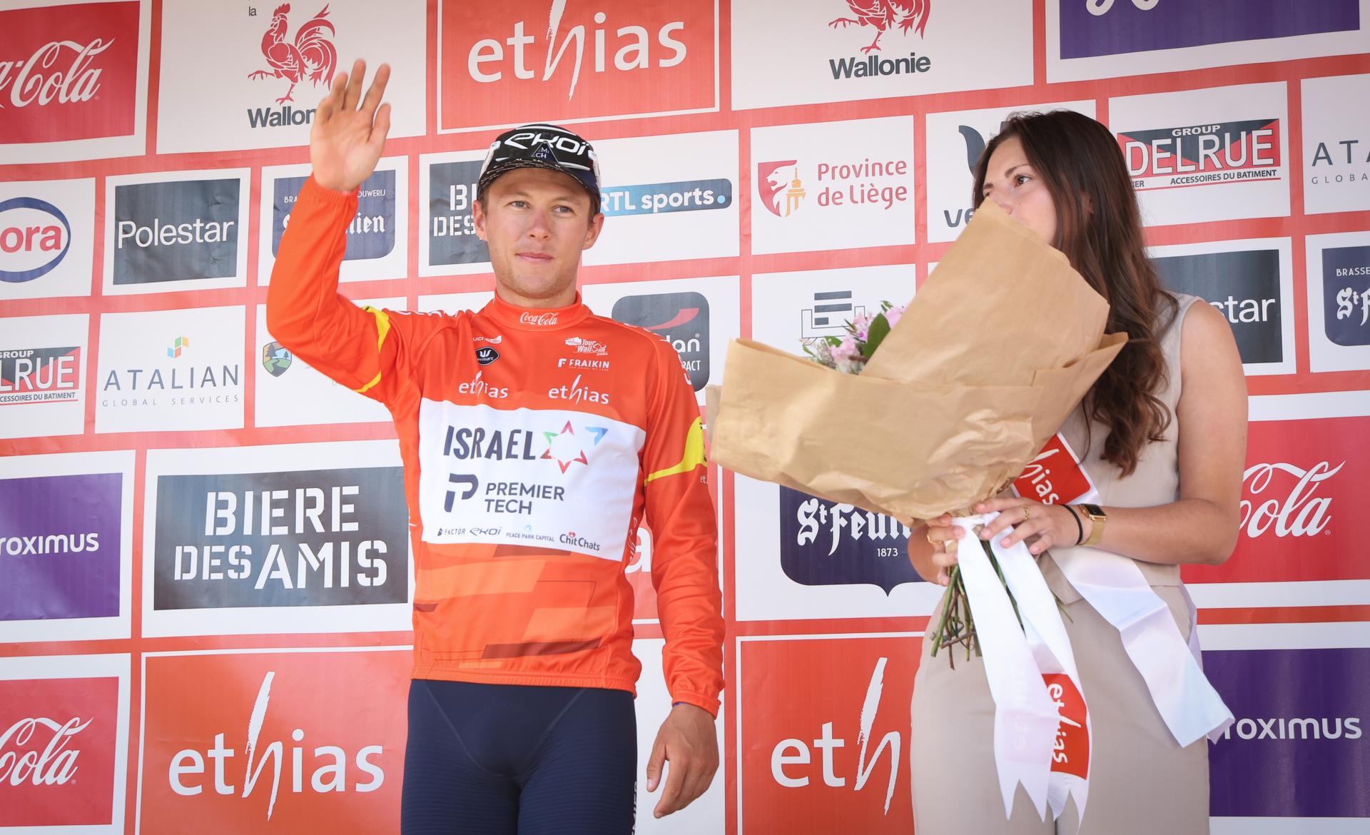 New Zealand's Corbin Strong of Israel-Premier Tech celebrates on the podium after stage 3 of the Tour De Wallonie cycling race, from Arlon to La-Roche-en-Ardenne (194 km), Wednesday 24 July 2024. This year's Tour de Wallonie takes place from 22 to 26 July 2023. BELGA PHOTO VIRGINIE LEFOUR