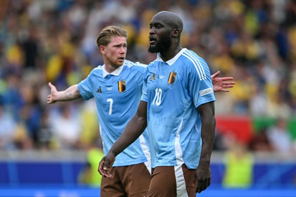 Belgium's forward #10 Romelu Lukaku and midfielder #07 Kevin de Bruyne react during the UEFA Euro 2024 Group E football match between Ukraine and Belgium at the Stuttgart Arena in Stuttgart on June 26, 2024.  Fabrice COFFRINI / AFP