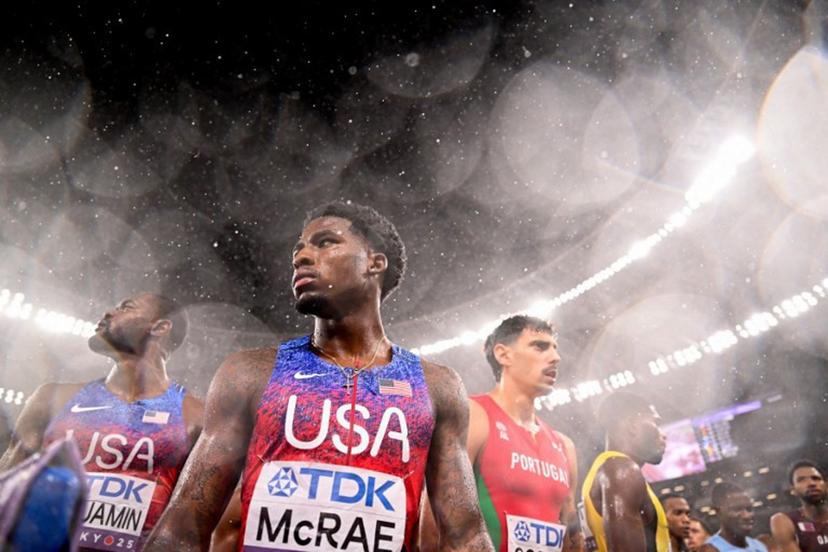 US' athlete Khaleb McRae and US' athlete Rai Benjamin (L) reacts as it rains after the men's 4x400m relay final during the World Athletics Championships in Tokyo on September 21, 2025.  Kirill KUDRYAVTSEV / AFP
