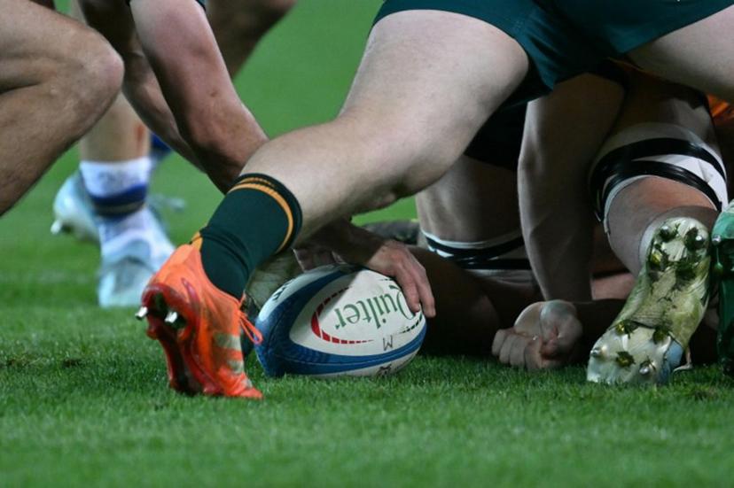 Australian players clear the ball in a scrum during the Autumn Nations Series international rugby union match between Italy and Australia (wallabies) at the Friuli stadium in Udine on November 8, 2025.  Stefano RELLANDINI / AFP