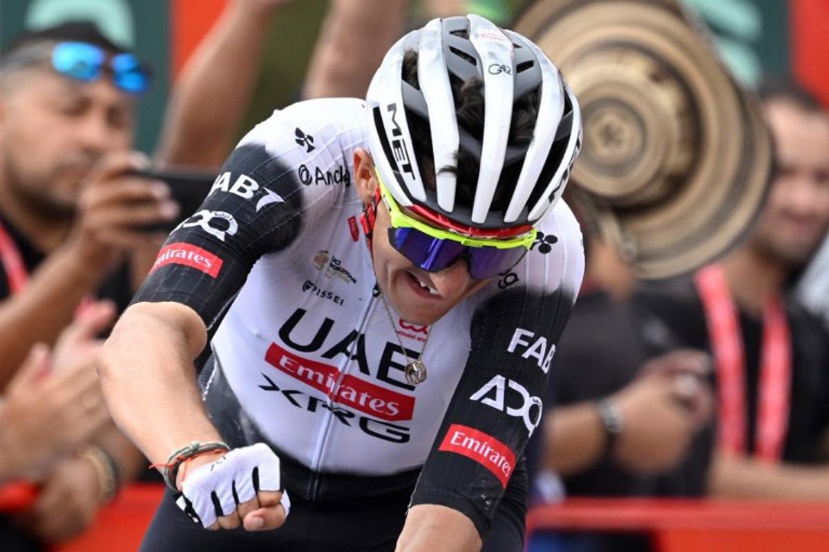 Team UAE's Spanish rider Marc Soler celebrates winning the 14th stage of the Vuelta a Espana cycling tour, a 135 km race between Aviles and La Farrapona in Somiedo, on September 6, 2025.    Miguel RIOPA / AFP
