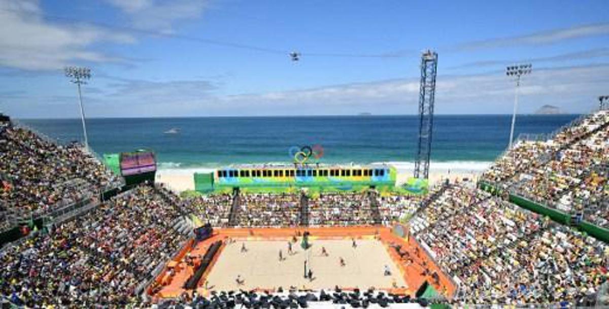 View of the stadium during the men's beach volleyball qualifying match between Canada and Cuba at the Beach Volley Arena in Rio de Janeiro on August 11, 2016. Canada's Chaim Schalk and Canada's Ben Saxton play against Cuba's Nivaldo Nadhir Diaz Gomez and Cuba's Sergio Reynaldo Gonzalez Bayard.
Leon NEAL / AFP