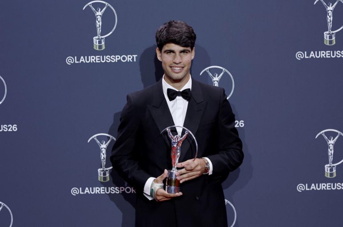 Spain's tennis player Carlos Alcaraz poses with the Sportsman of the Year Award during the 27th Laureus World Sports Awards gala in Madrid on April 20, 2026.  Oscar DEL POZO / AFP