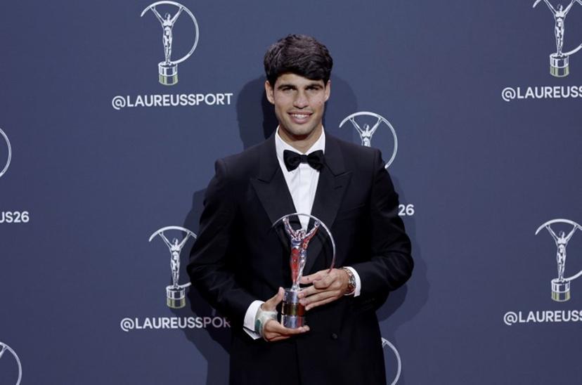 Spain's tennis player Carlos Alcaraz poses with the Sportsman of the Year Award during the 27th Laureus World Sports Awards gala in Madrid on April 20, 2026.  Oscar DEL POZO / AFP