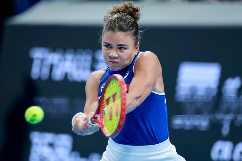 Italy's Jasmine Paolini hits a return to China's Zheng Qinwen during their women's singles quarter-final match at the Billie Jean King Cup tennis tournament in Shenzhen, southern China's Guangdong province on September 24, 2026.  CN-STR / AFP