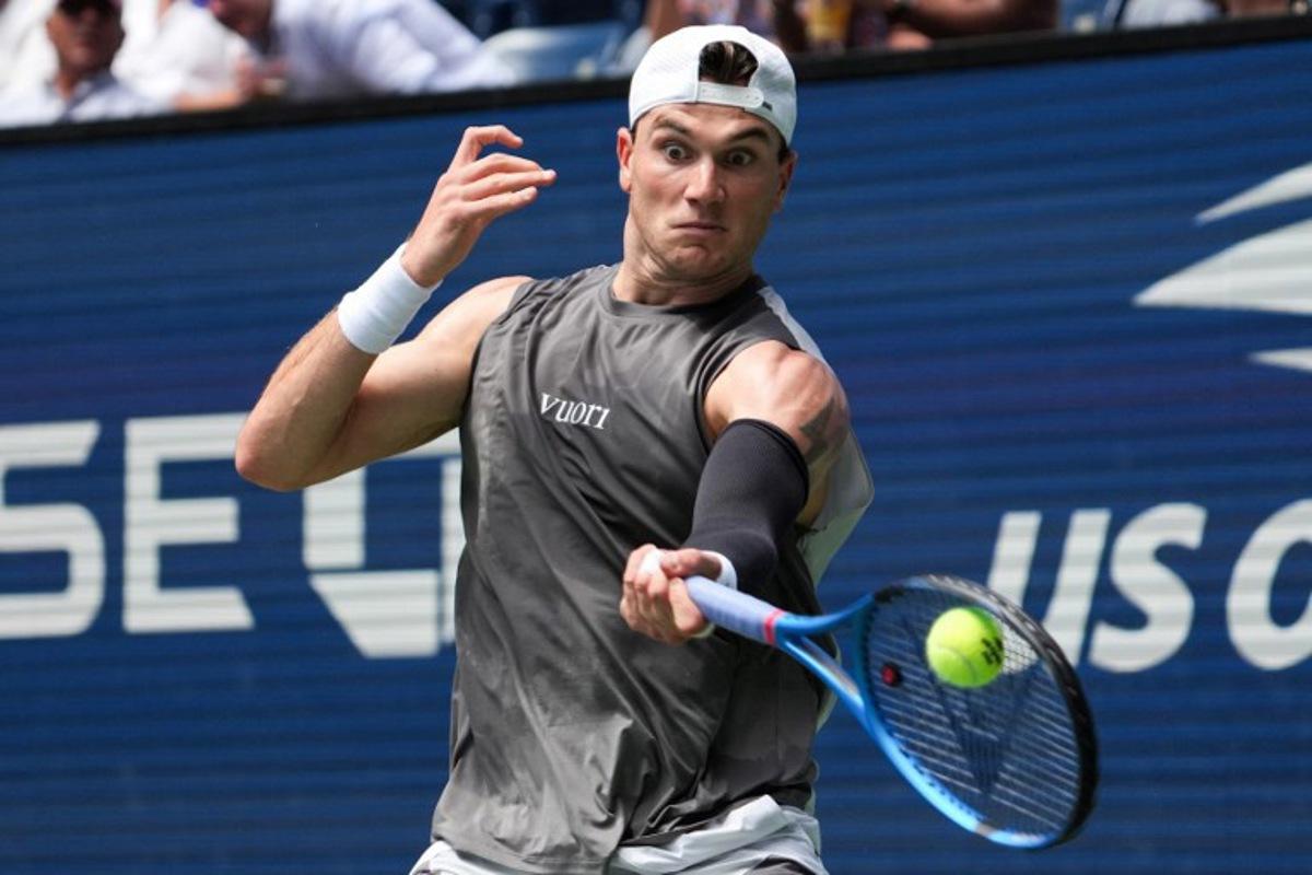 Britain's Jack Draper plays a return to Argentina's Federico Agustin Gomez during their men's singles first round tennis match on day two of the US Open tennis tournament at the USTA Billie Jean King National Tennis Center in New York City, on August 25, 2025.  TIMOTHY A. CLARY / AFP
