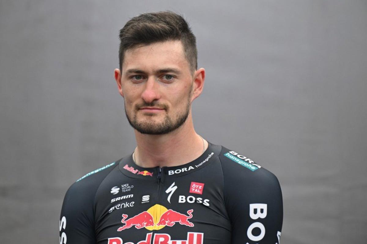 Germany's Nico Denz attends the presentation of the new Red Bull-Bora-Hansgrohe cycling team in Salzburg, Austria, on June 26, 2024. Red Bull on June 26, 2024 unveiled its eight-rider cycling team to debut in this week's Tour de France, marking the energy drink maker's latest expansion of its sports empire. Earlier this year, Red Bull bought a controlling stake in the German Bora-Hansgrohe cycling team.  KERSTIN JOENSSON / AFP