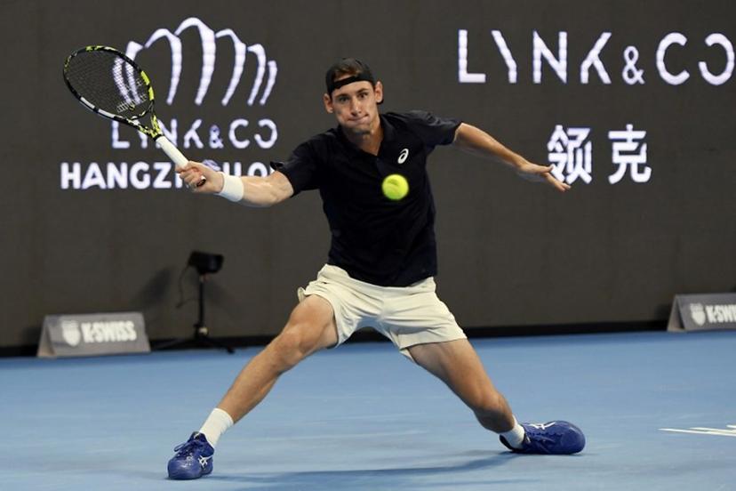 France's Valentin Royer hits a return to France's Corentin Moutet during their men's singles semi-final match at the Hangzhou Open tennis tournament in Hangzhou, in China's eastern Zhejiang province on September 22, 2025.  STR / AFP