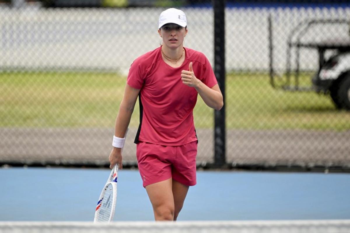 Poland's Iga Swiatek gestures during a practice session ahead of the United Cup tennis tournament in Sydney on January 2, 2026.  Saeed KHAN / AFP