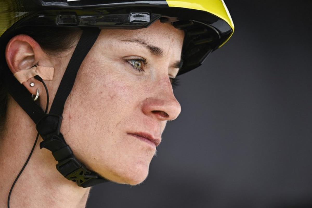 Team Visma | Lease a Bike's Dutch rider Marianne Vos wearing the overall leader's yellow jersey awaits the start of the 5th stage (out of 9) of the fourth edition of the Women's Tour de France cycling race, 165.8 km from Chasseneuil-du-Poitou to Gueret, central France on July 30, 2025.  JULIEN DE ROSA / AFP