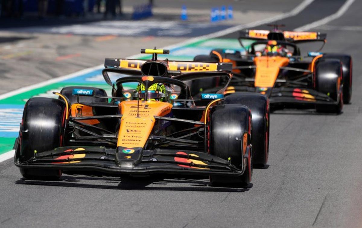 McLaren's British driver Lando Norris (L) and McLaren's Australian driver Oscar Piastri drive during the qualifying session at the Red Bull Ring race track in Spielberg, Austria, on June 28, 2025, ahead of the Formula One Austrian Grand Prix.  Darko Bandic / POOL / AFP
