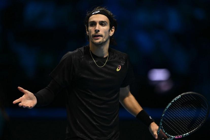 Italy's Lorenzo Musetti reacts during his match against Spain's Carlos Alcaraz at the ATP Finals tennis tournament in Turin on November 13, 2025.  Marco BERTORELLO / AFP