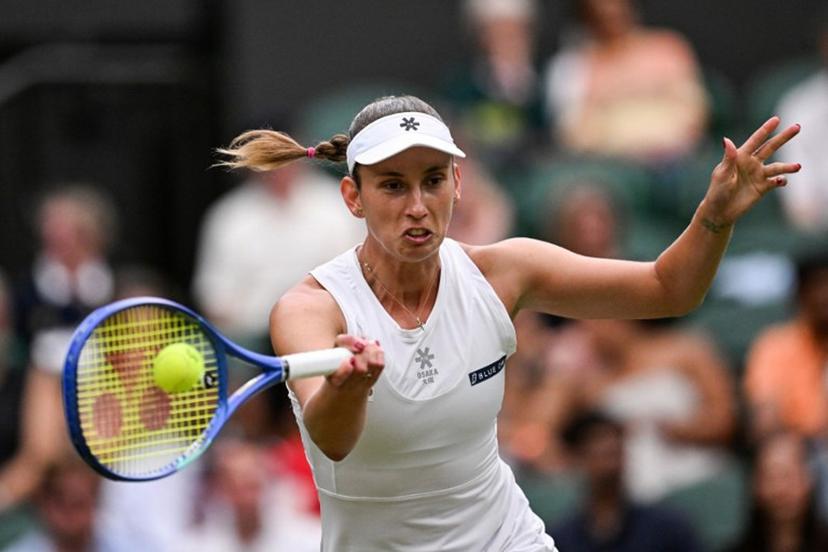 Belgium's Elise Mertens plays a forehand return to Belarus's Aryna Sabalenka during their women's singles fourth round tennis match on the seventh day of the 2025 Wimbledon Championships at The All England Lawn Tennis and Croquet Club in Wimbledon, southwest London, on July 6, 2025.  Kirill KUDRYAVTSEV / AFP