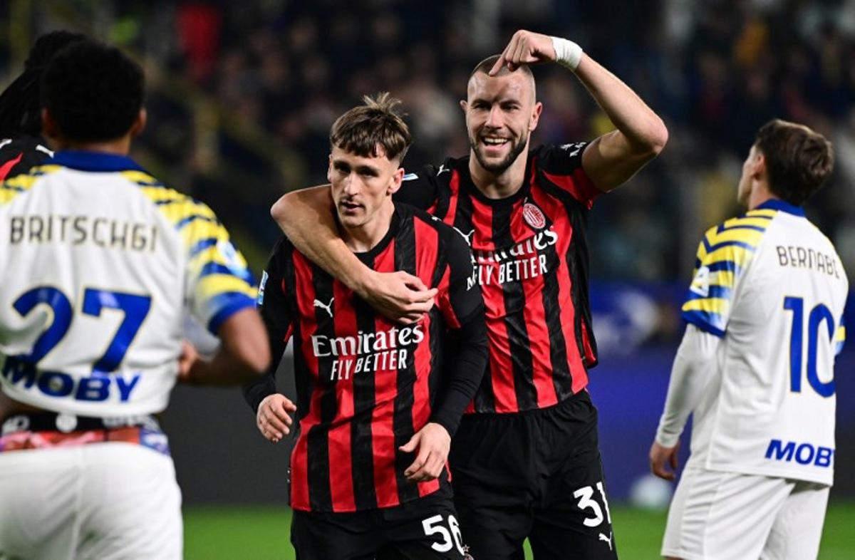 AC Milan's Belgian midfielder #56 Alexis Saelemaekers (C) celebrates after scoring his team first goal with AC Milan's Serbian defender #31 Strahinja Pavlovic (2nd R) during the Italian Serie A football match between Parma and AC Milan at the San Siro Stadium in Parma, northern Italy, on November 8, 2025.  Piero CRUCIATTI / AFP