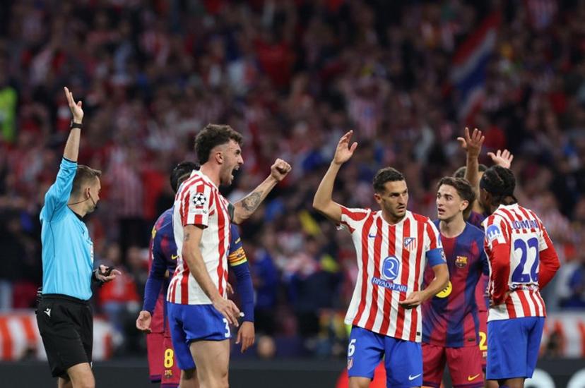 Atletico Madrid's Italian defender #03 Matteo Ruggeri and Atletico Madrid's Spanish midfielder #06 Koke celebrate as French referee Clement Turpin rules offsides on a Barcelona goal during the UEFA Champions League quarter final second leg football match between Club Atletico de Madrid and FC Barcelona at Metropolitano Stadium in Madrid on April 14, 2026.  Oscar DEL POZO / AFP