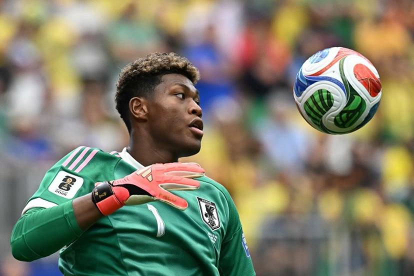 (FILES) Japan's goalkeeper Zion Suzuki eyes the ball during the 2026 World Cup round of 32 football match between Brazil and Japan at the Houston Stadium in Houston on June 29, 2026. Zion Suzuki has had to overcome costly mistakes and racist abuse on the way to becoming the most expensive Japanese goalkeeper in history. The 23-year-old is reportedly set to join Premier League Aston Villa from Italian team Parma for up to 35 million euros ($40 million) following an impressive World Cup.  Paul ELLIS / AFP