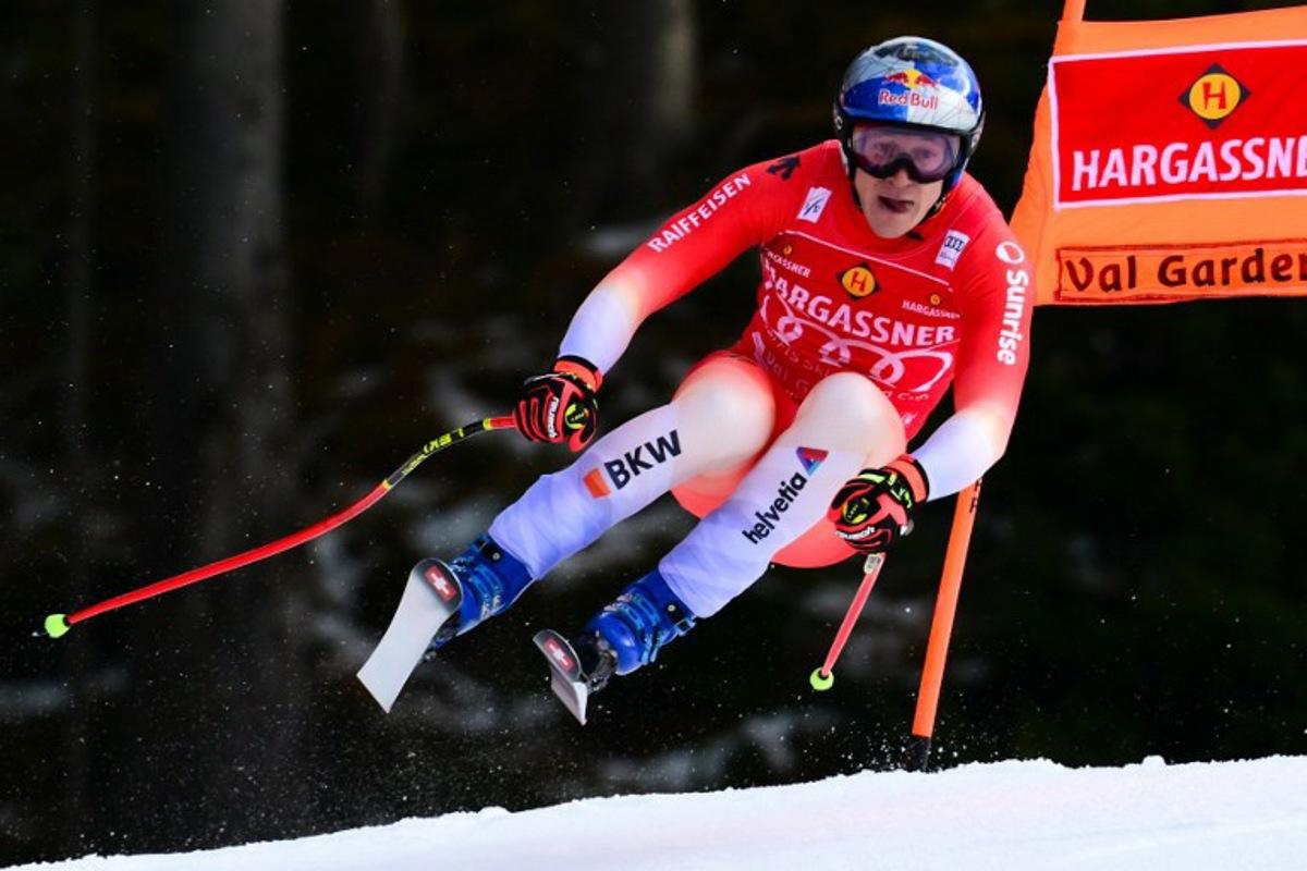 Switzerland's Marco Odermatt competes in the men's Downhill, replacing the Beaver Creek competition, during the FIS Alpine Ski World Cup in Val Gardena on December 18, 2025.  The Italian organizers have indeed agreed to host on their course one of the two downhill races scheduled last month in Beaver Creek (United States), which was canceled due to weather conditions. Stefano RELLANDINI / AFP