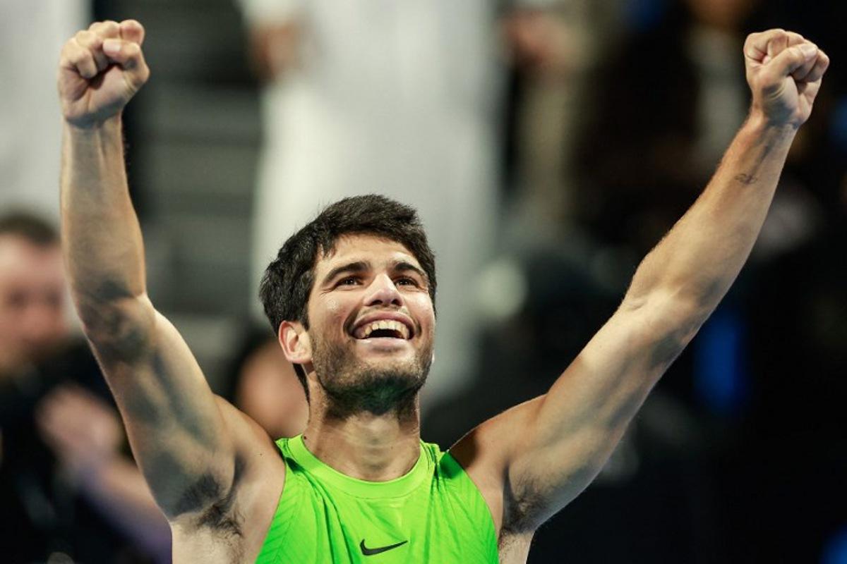 Spain's Carlos Alcaraz celebrates after winning his men's singles final match against France's Arthur Fils at the Qatar Open tennis tournament in Doha on February 21, 2026.  Karim JAAFAR / AFP