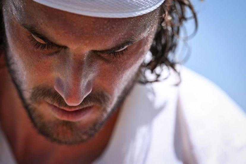 Greece's Stefanos Tsitsipas reacts as he plays against France's Valentin Royer during their men's singles first round tennis match on the first day of the 2025 Wimbledon Championships at The All England Lawn Tennis and Croquet Club in Wimbledon, southwest London, on June 30, 2025.  Kirill KUDRYAVTSEV / AFP