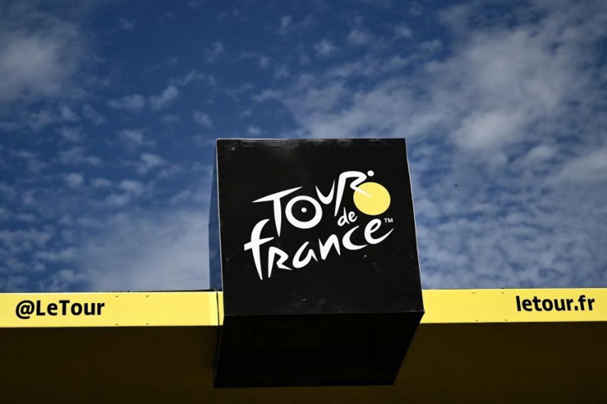 The Tour de France logo adorns the podium at the finish line of the 12th stage of the 111th edition of the Tour de France cycling race, 203,6 km between Aurillac and Villeneuve-sur-Lot, southwestern France, on July 11, 2024.  Marco BERTORELLO / AFP