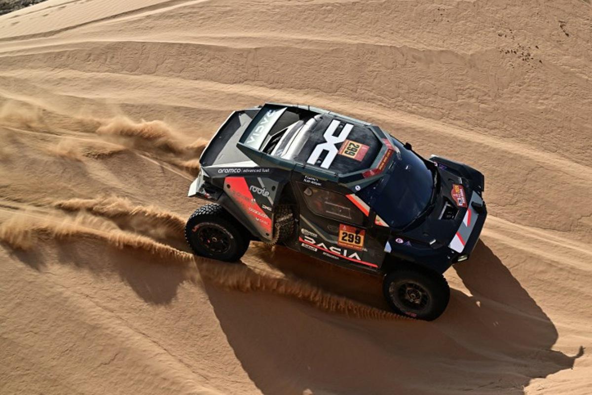 The Dacia Sandriders's Qatari driver Nasser Al‑Attiyah and Belgian co‑pilot Fabian Lurquin compete in Stage 12 of the 48th edition of the Dakar Rally 2026, between al-Henakiyah and Yanbu, Saudi Arabia, on January 16, 2026.  Giuseppe CACACE / AFP