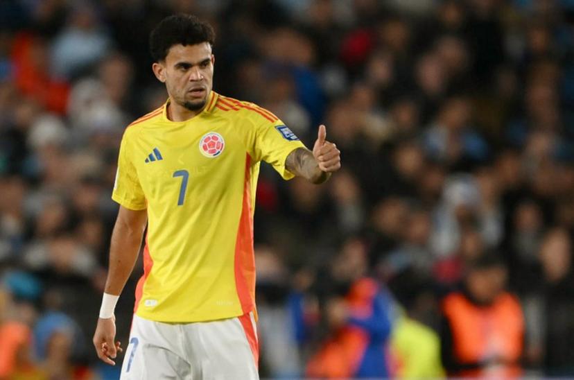 Colombia's forward #07 Luis Diaz celebrates after scoring his team's first goal during the 2026 FIFA World Cup South American qualifiers football match between Argentina and Colombia at the Mas Monumental stadium in Buenos Aires, on June 10, 2025.   Luis ROBAYO / AFP