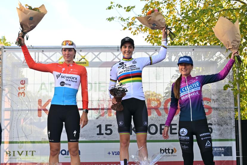 Luxembourg's Marie Schreiber; Netherlands' Lucinda Brand and Netherlands' Denise Betsema celebrate on the podium after  the women elite race of the 'Kermiscross' cyclocross cycling event, on Thursday 15 October 2026, in Ardooie. BELGA PHOTO DAVID PINTENS