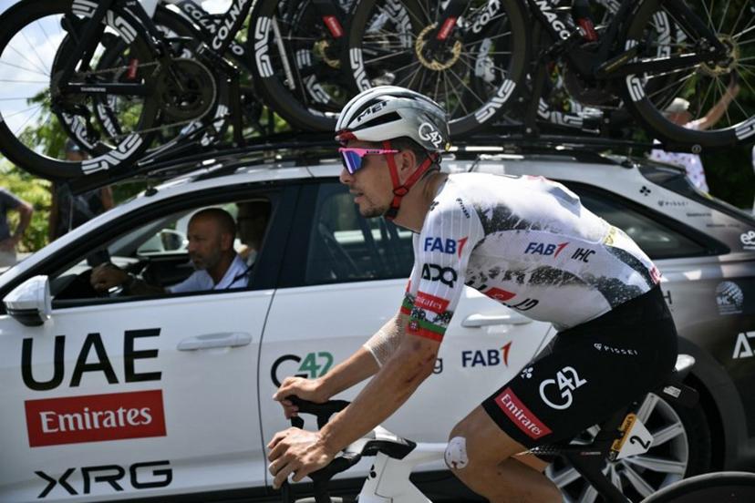 UAE Team Emirates - XRG team's Portuguese rider Joao Almeida cycles alongside his team support vehicle during the 9th stage of the 112th edition of the Tour de France cycling race, 174.1 km between Chinon and Chateauroux, central France, on July 13, 2025.  Marco BERTORELLO / AFP