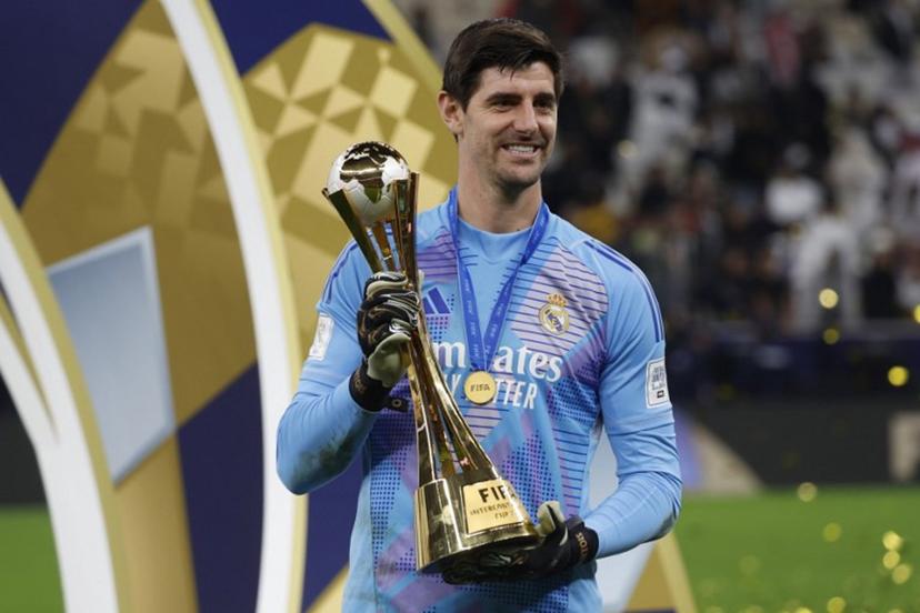Real Madrid's Belgian goalkeeper #1 Thibaut Courtois poses with the tournament trophy during the podium ceremony after the 2024 FIFA Intercontinental Cup final football match between Spain's Real Madrid and Mexico's Pachuca at the Lusail Stadium in Doha on December 18, 2024.  KARIM JAAFAR / AFP