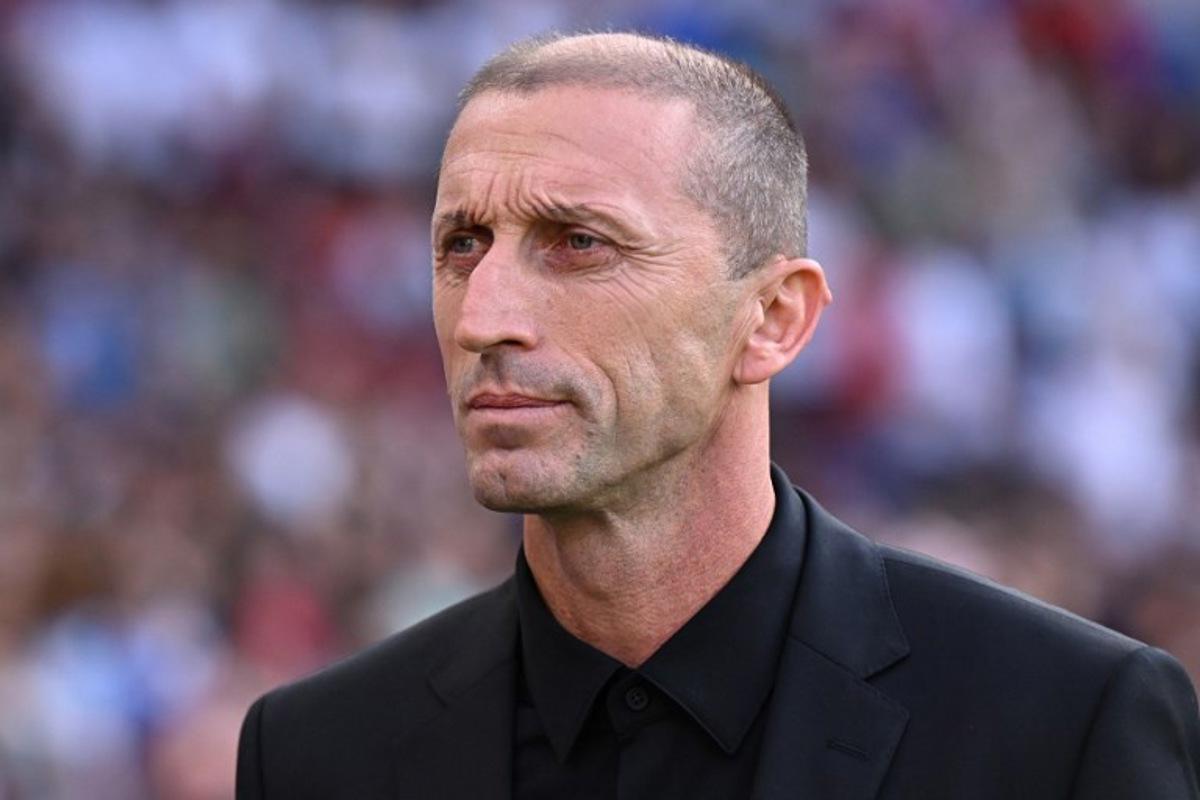 North Macedonia's coach Blagoja Milevski arrives ahead of the UEFA Euro 2024 group C qualification football match between England and North Macedonia at Old Trafford in Manchester, north west England, on June 19, 2023.  Oli SCARFF / AFP