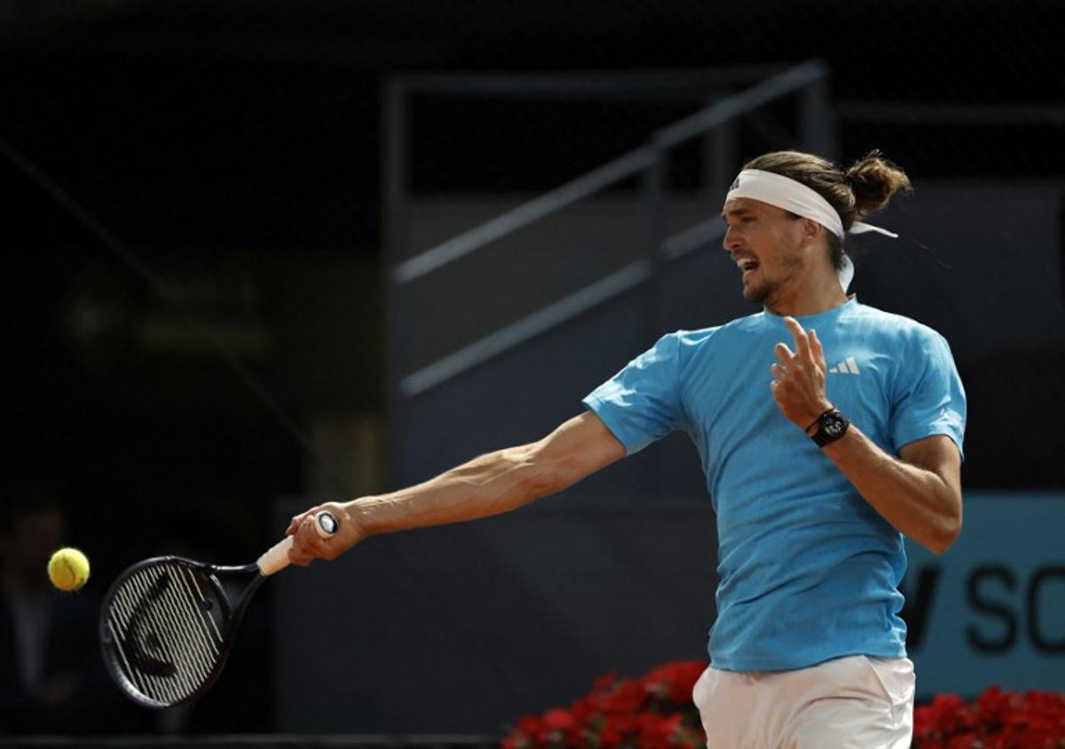 Germany's Alexander Zverev returns the ball to Czech Republic's Jakub Mensik during their 2026 ATP Tour Madrid Open tennis tournament singles match at the Caja Magica in Madrid, on April 28, 2026.  OSCAR DEL POZO / AFP